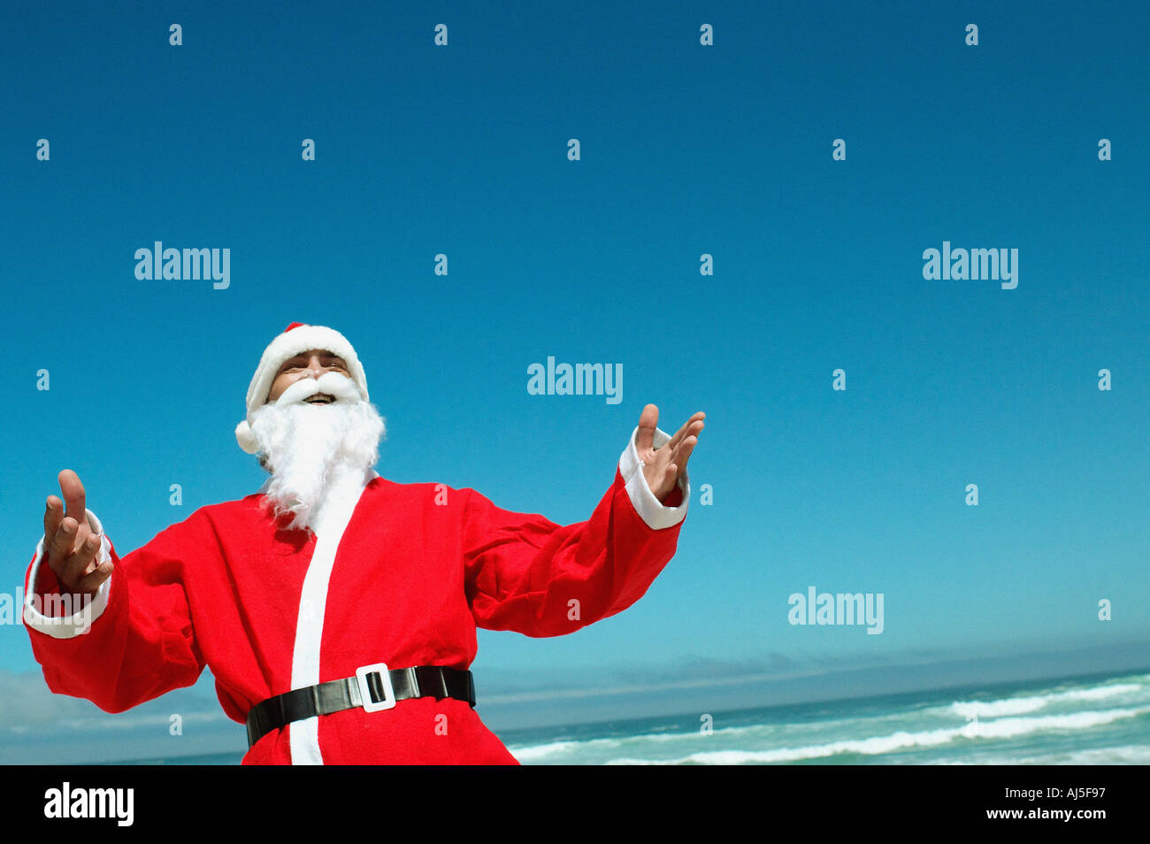 Santa on the beach Stock Photo Alamy