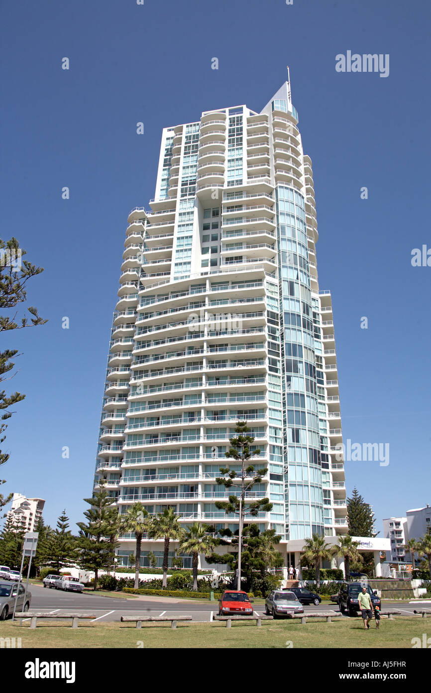 Tall modern appartment of unit tower block with trees in Surfers Paradise Queensland QLD Australia Stock Photo