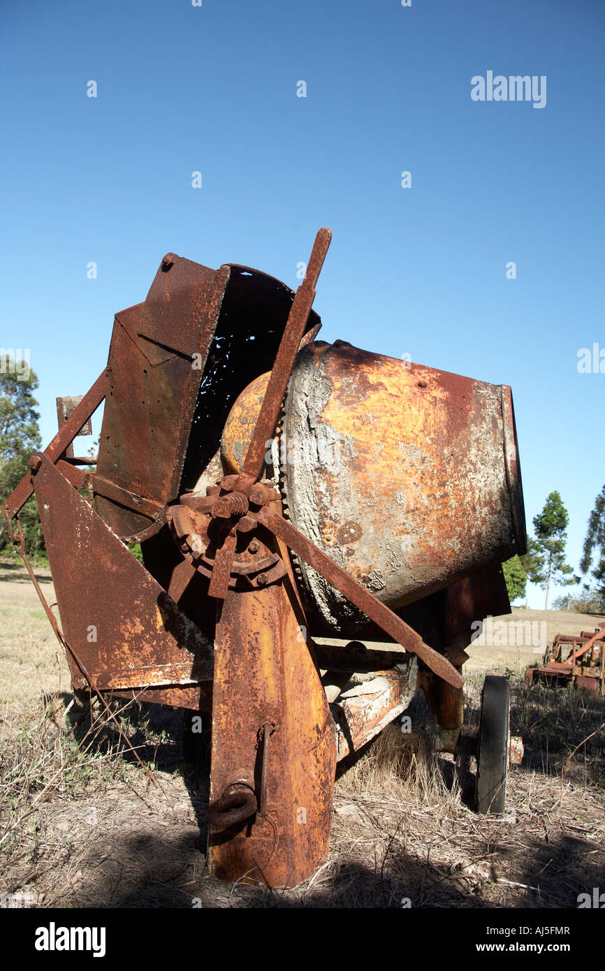 Abstract image of old rusty concrete or cement mixer on farm in Queensland QLD Australia Stock Photo