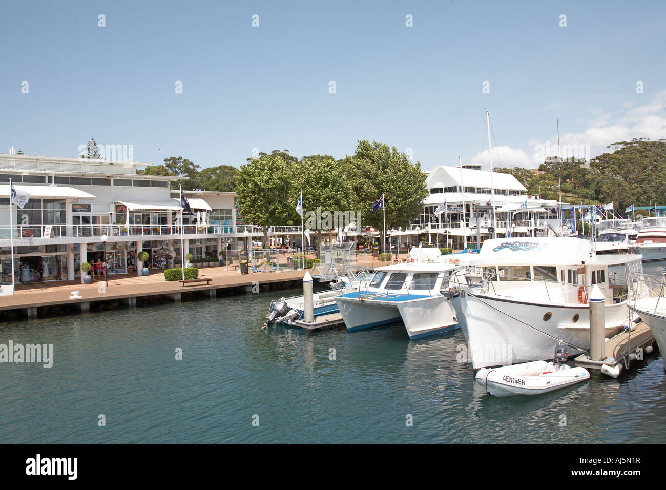 Marina harbour and town of Nelson Bay with boats and cruisers in Port Stephens New South Wales NSW Australia Stock Photo