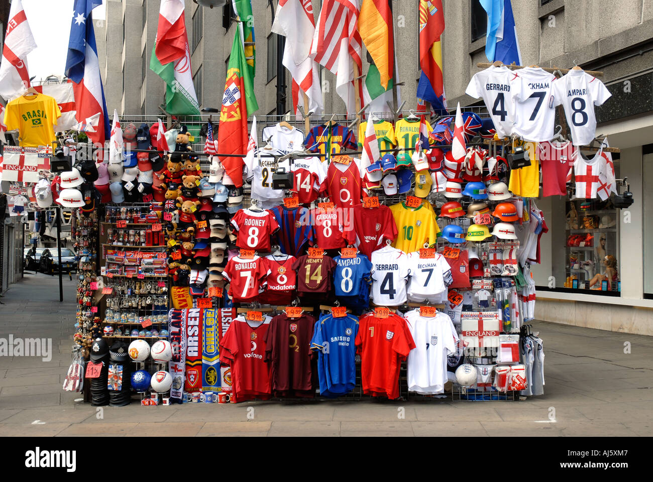 Football shirts on an Oxford Street stall London Stock Photo Alamy