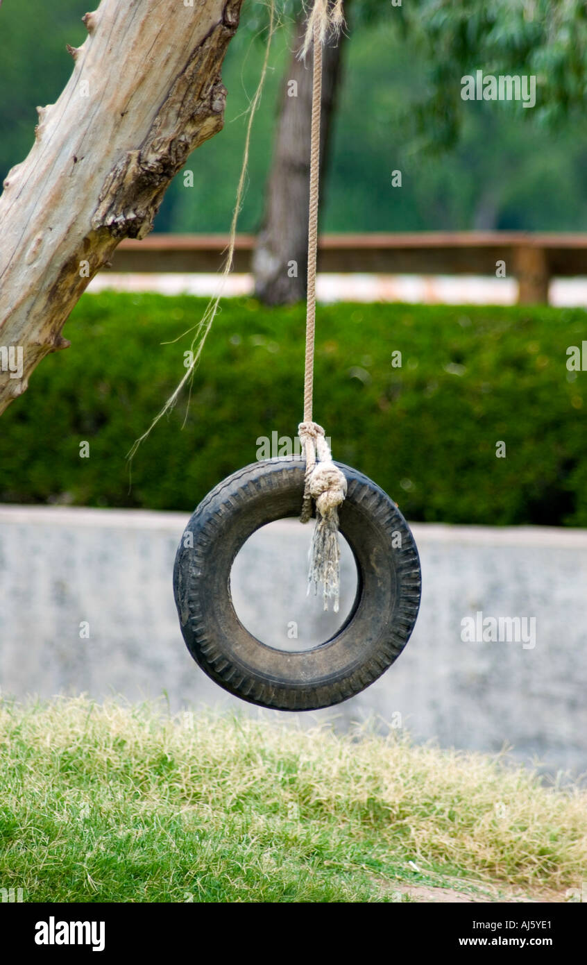 Tire swing hanging from tree hires stock photography and images Alamy