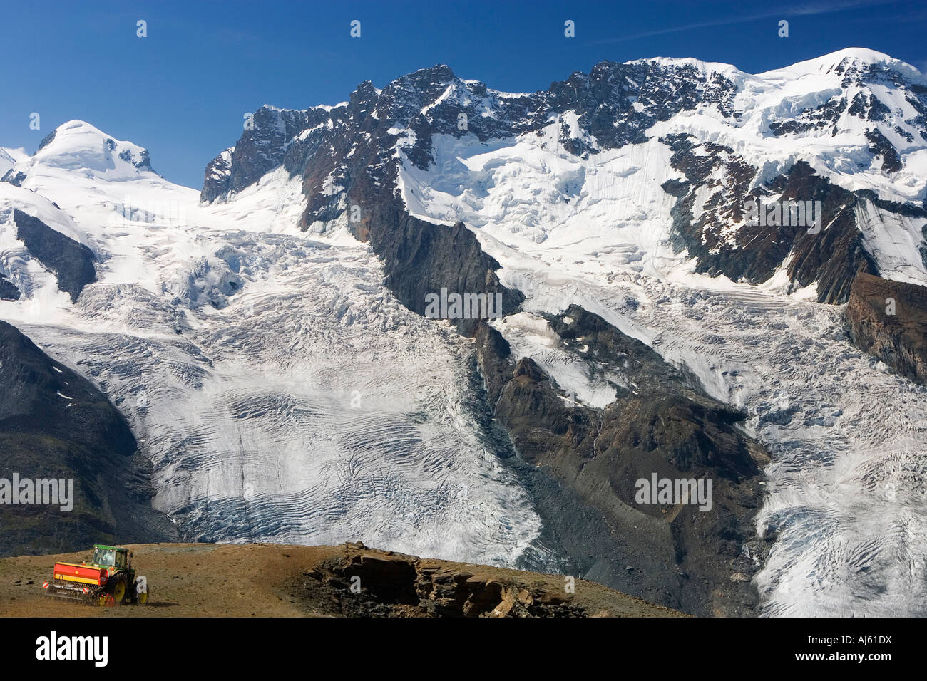 Digital Composite Of A Tractor Drilling A Mountainside With Seed Gorner 