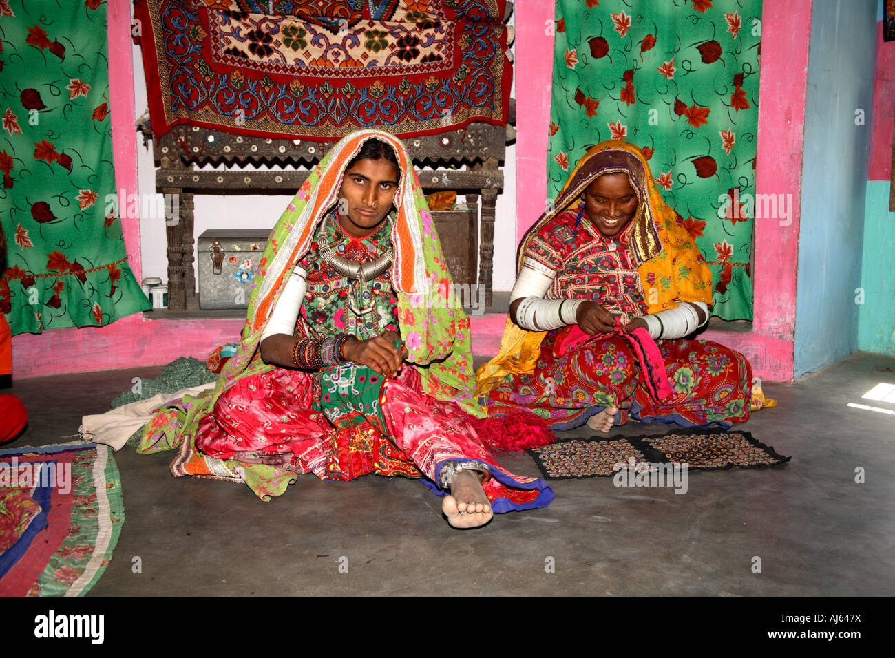 Harijan tribal women in their bhungas mud hut, Bhirandiara Village, Kutch District, Gujarat, India Stock Photo
