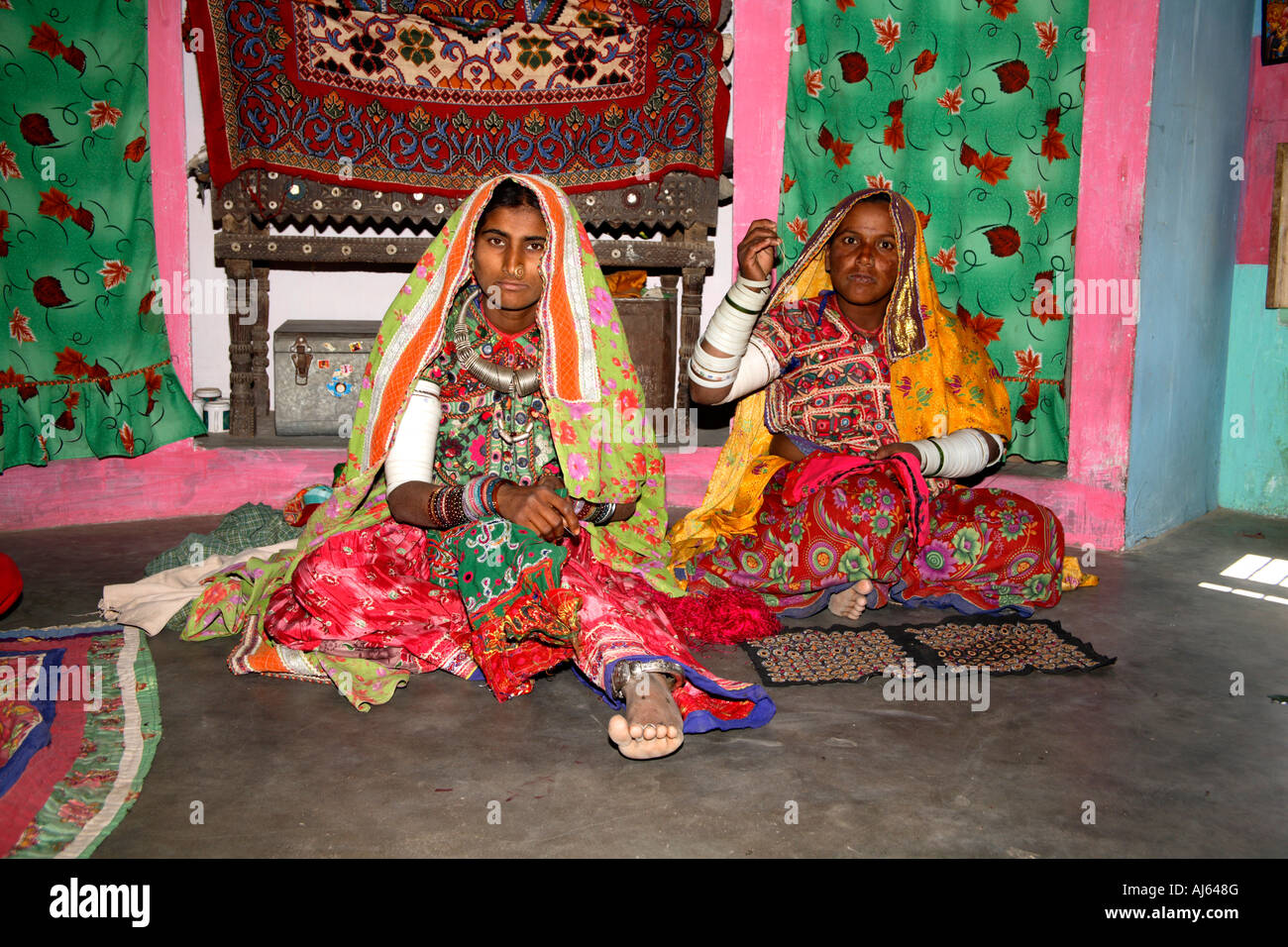 Harijan tribal females in their bhungas mud hut, Bhirandiara Village, Kutch District, Gujarat, India Stock Photo