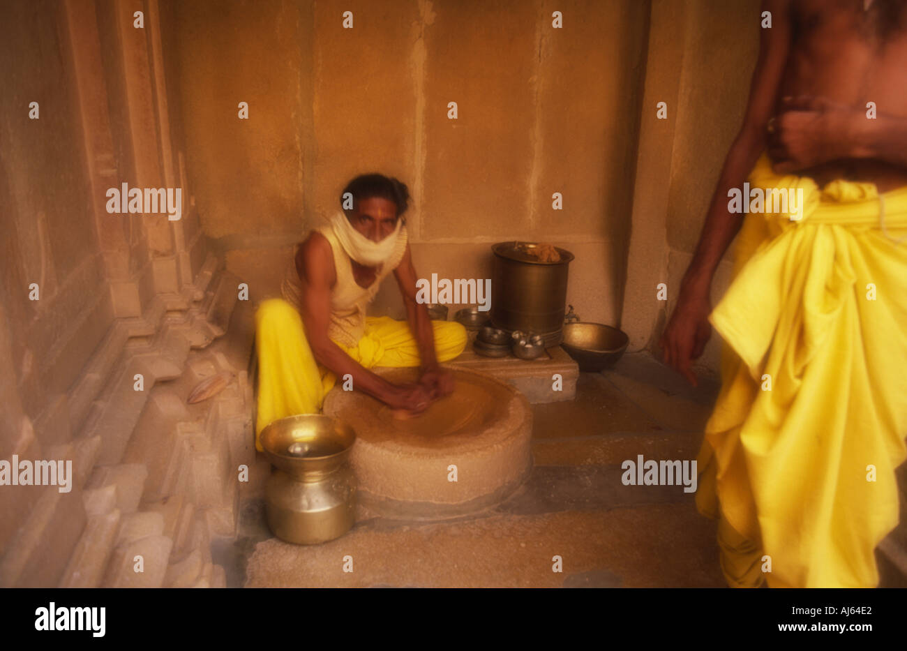 Jain man making bread dough inside temple in Jaisalmer, Rajasthan, India Stock Photo Alamy
