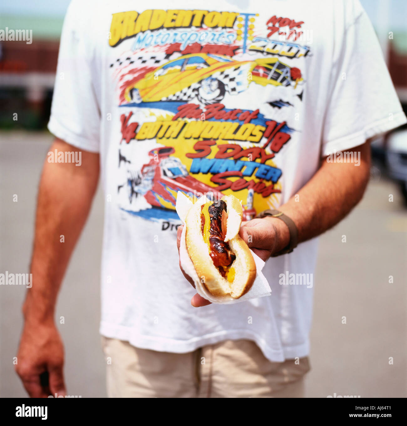 Man holding a hotdog with mustard and tomato ketchup Fort Erie Ontario Canada Stock Photo Alamy