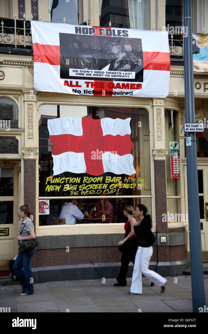 Cross of St. George flag flying from pub window, Hop Poles, Hammersmith, west London, 2006 World Cup Finals Stock Photo