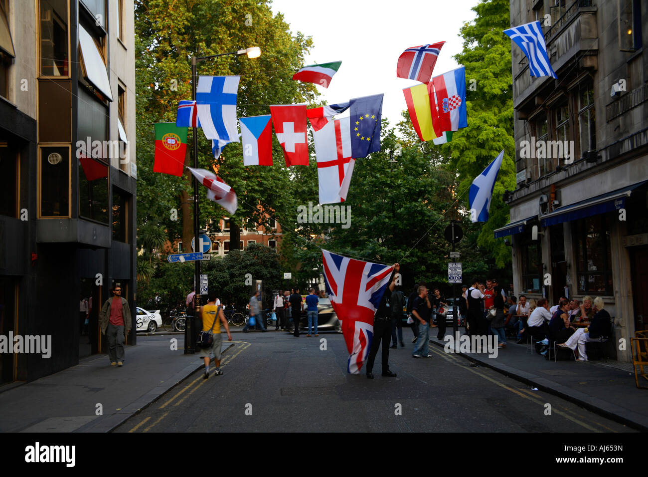 National Flags hanging between buildings in Soho, London during 2006 World Cup Finals Stock Photo