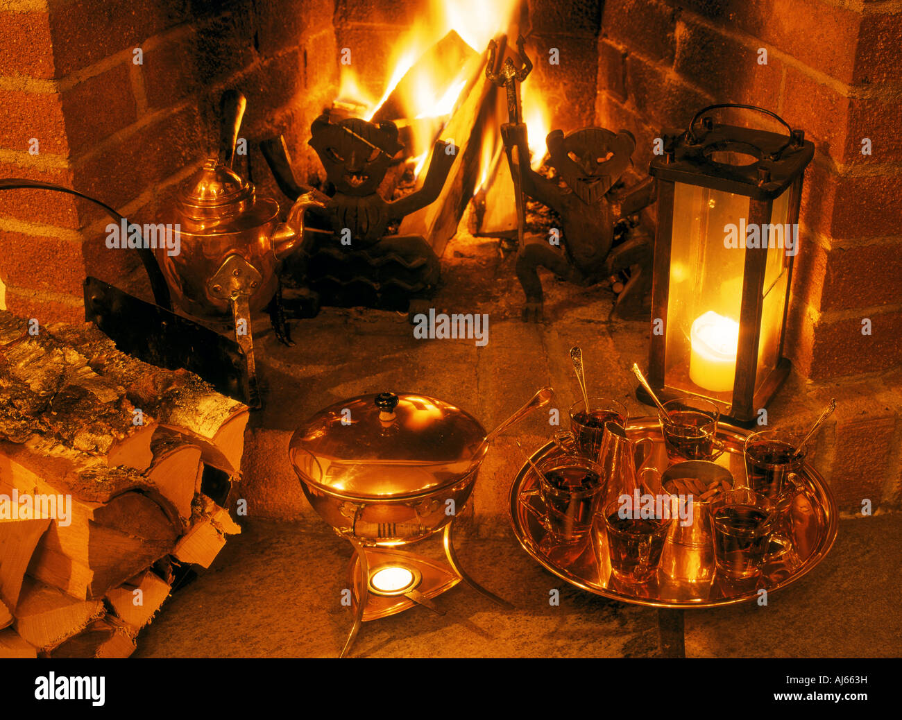 Warm fireplace and warm glögg for cold winter nights in Sweden Stock Photo