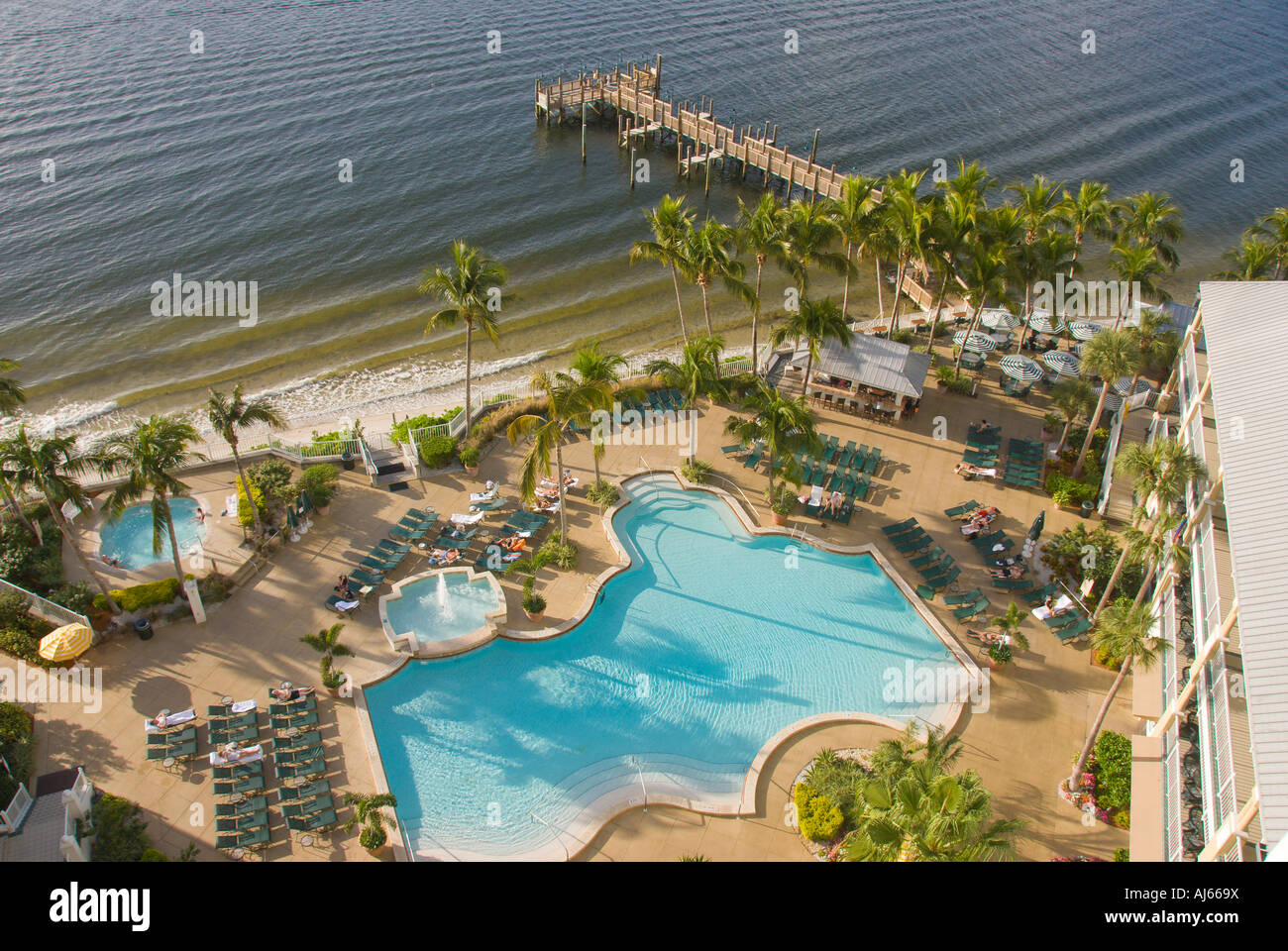 Swimming pool next to beach and fishing dock, aerial, Sanibel Harbour