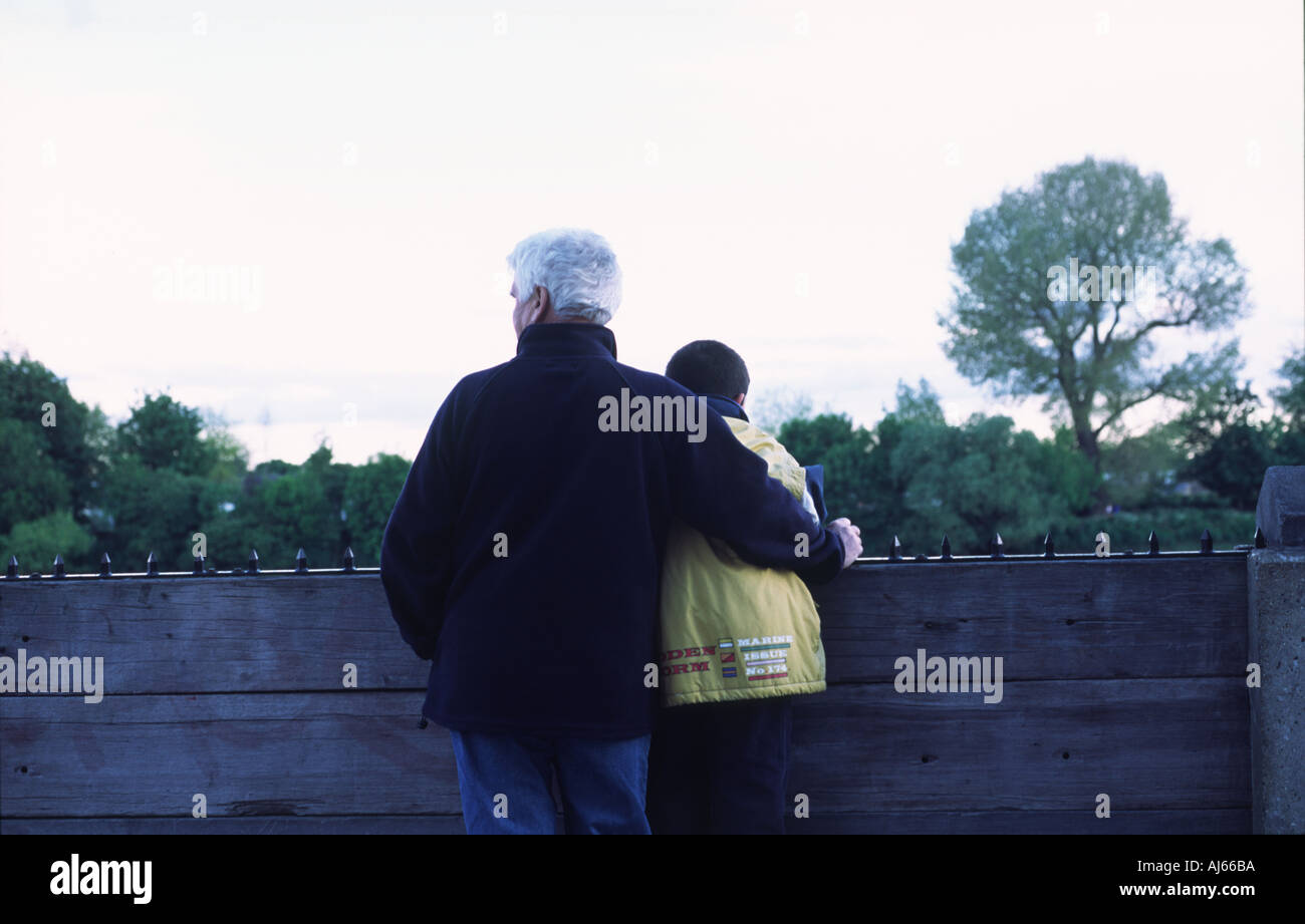 Father and Son Look At River Thames London UK Stock Photo