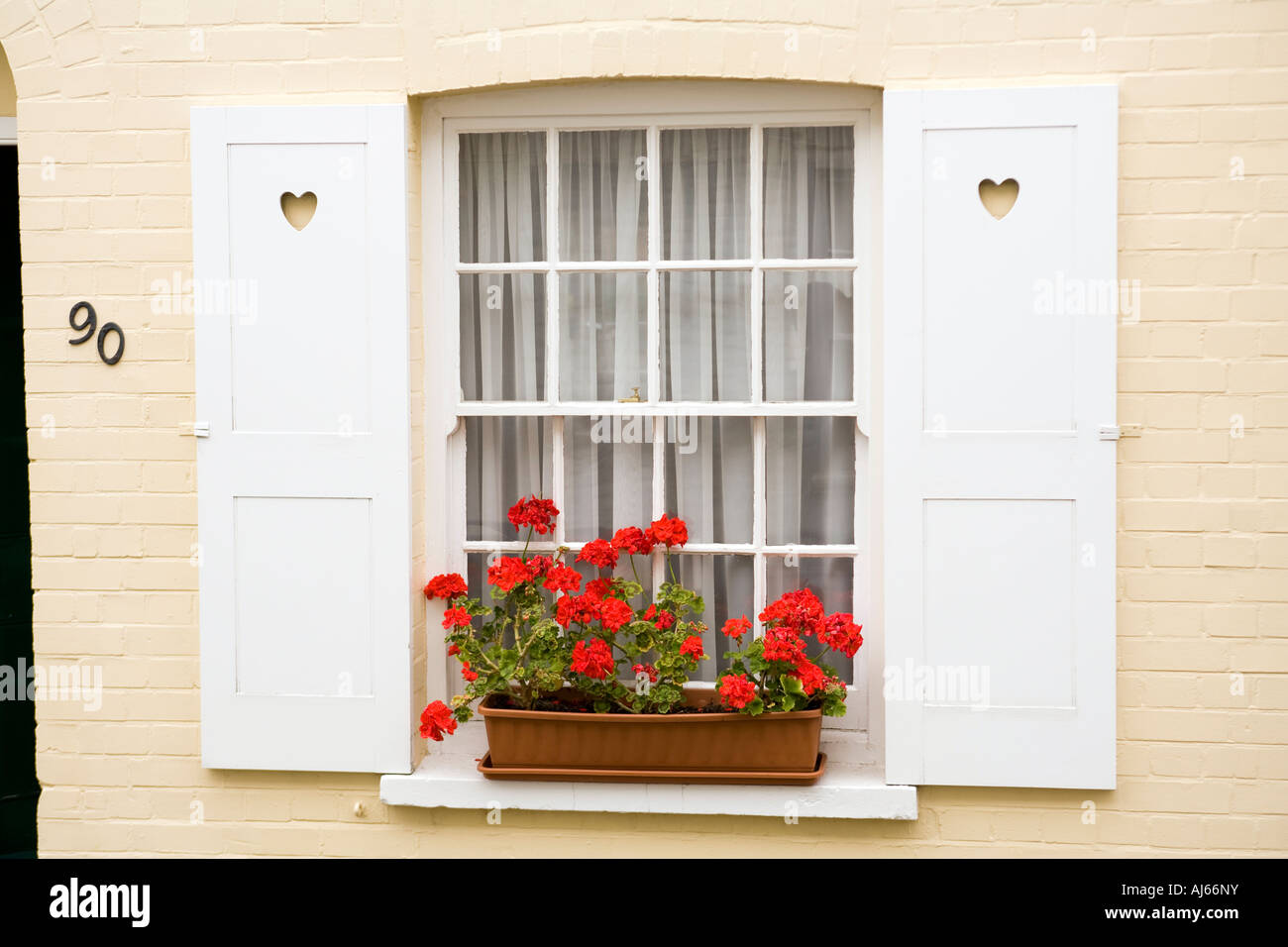 UK Kent Deal Old Town Middle Street red geraniums in window box Stock Photo