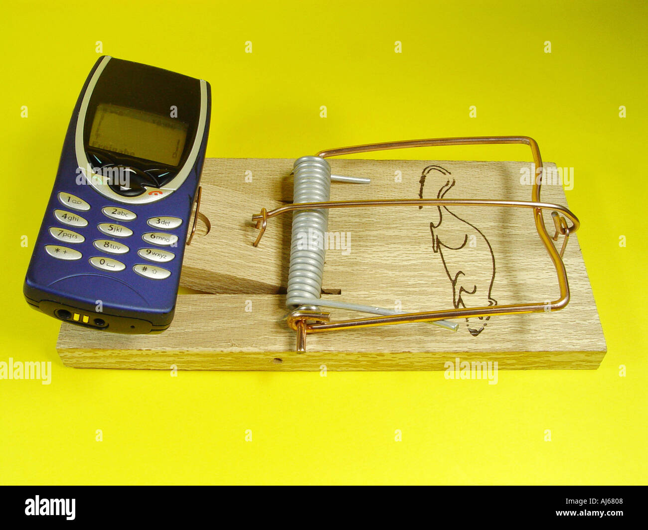 Telephone on a mousetrap symbol for the rising telephone costs and expensive increase in value numbers Stock Photo