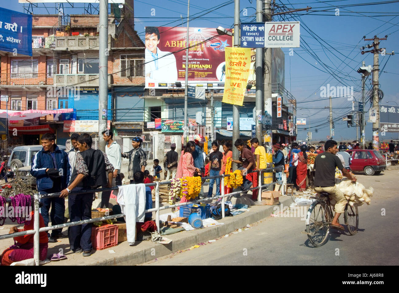 rush hour streets of Kathmandu CITY center NEPAL Asia Katmandu people traffic cyclist transportation fowl poultry at a bike Stock Photo