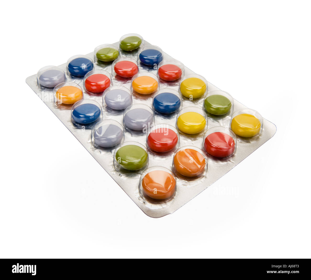 colored coloured pills tabs in blister pack tablet troche red green yellow blue grey gray close up closeup on white background c Stock Photo