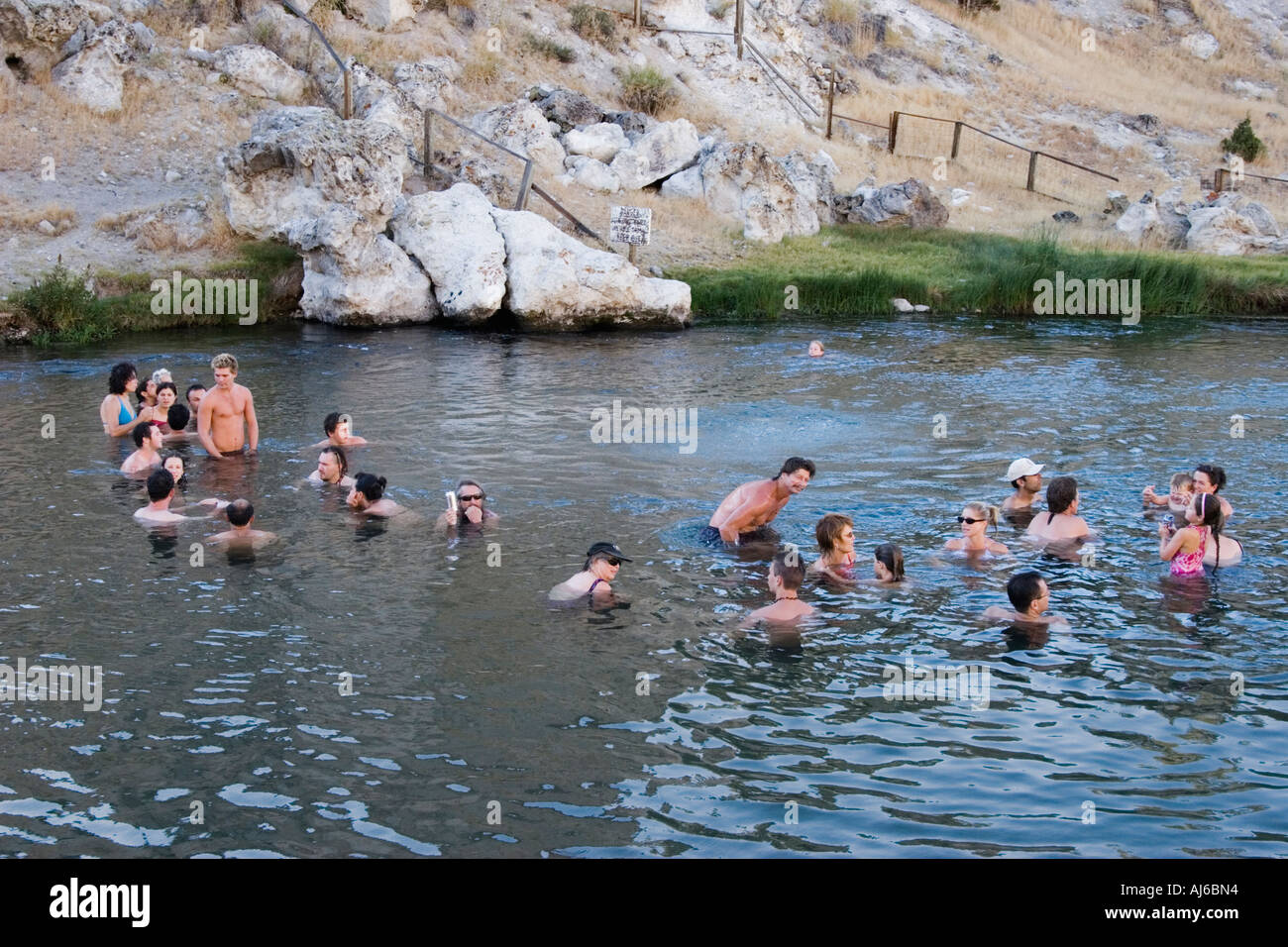People enjoying the hot springs at Hot Creek Geological Site in the