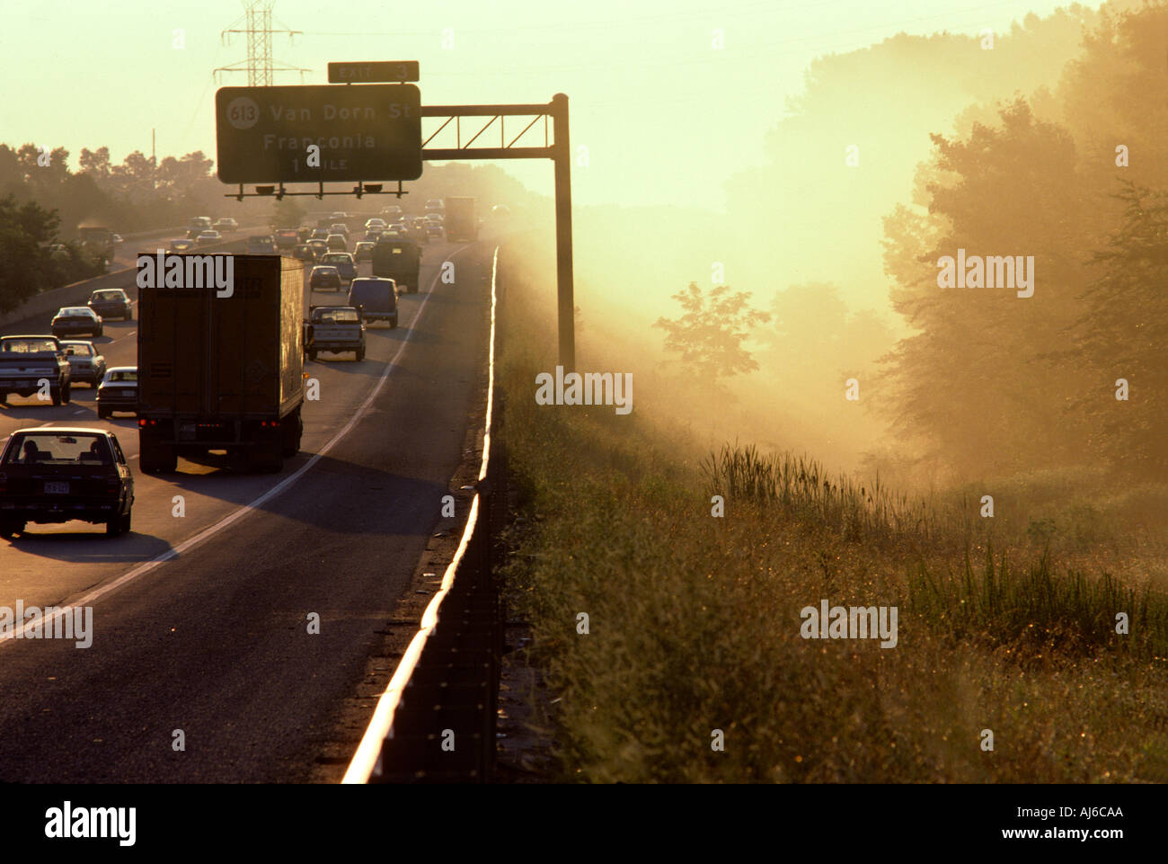 Foggy highway with trucks and cars Stock Photo - Alamy