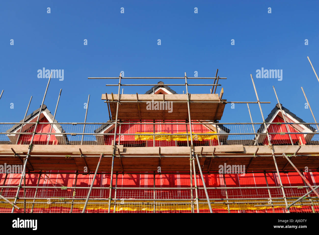 New environmental friendly residential buildings showing the pink cavity insulation material used for the construction. Stock Photo