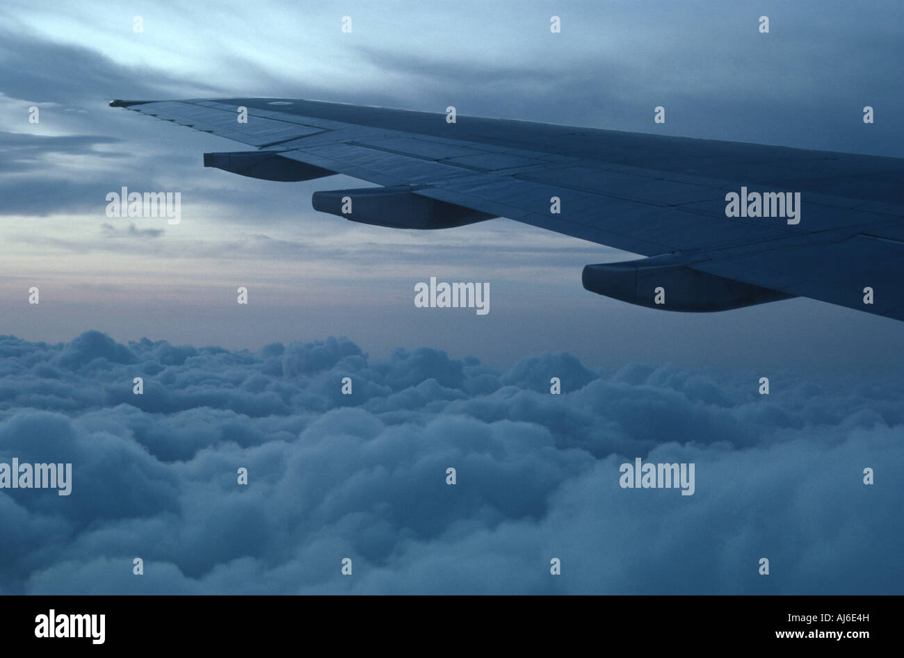 above the clouds - wing of an airplane Stock Photo - Alamy