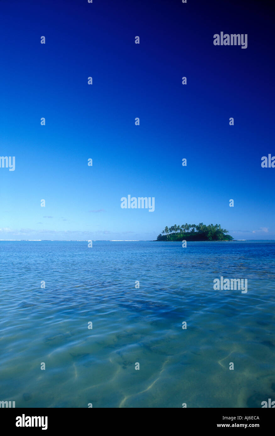 Small tropical island on horizon in the Cook Islands Polynesia South Pacific Ocean Stock Photo