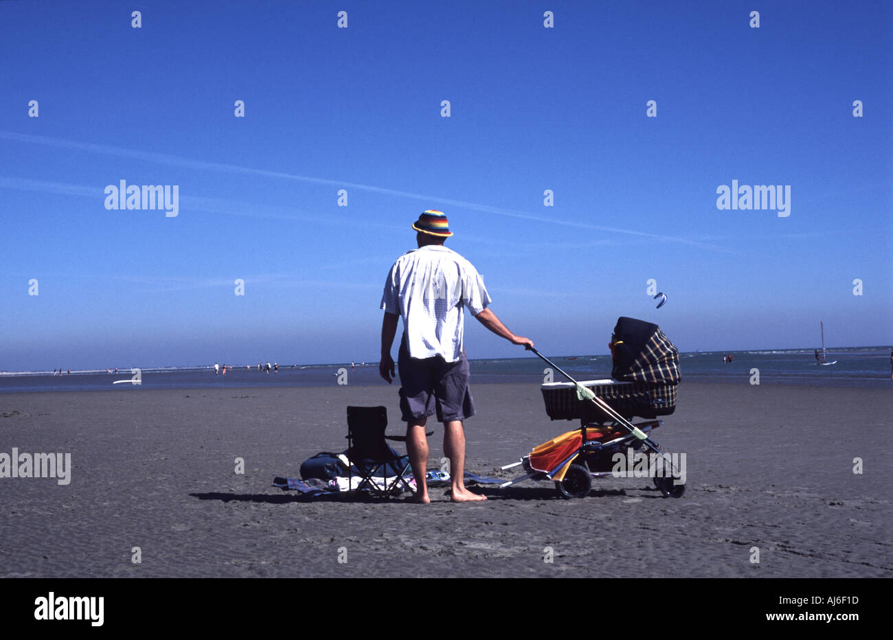 Single Father with Pram On Beach Stock Photo Alamy