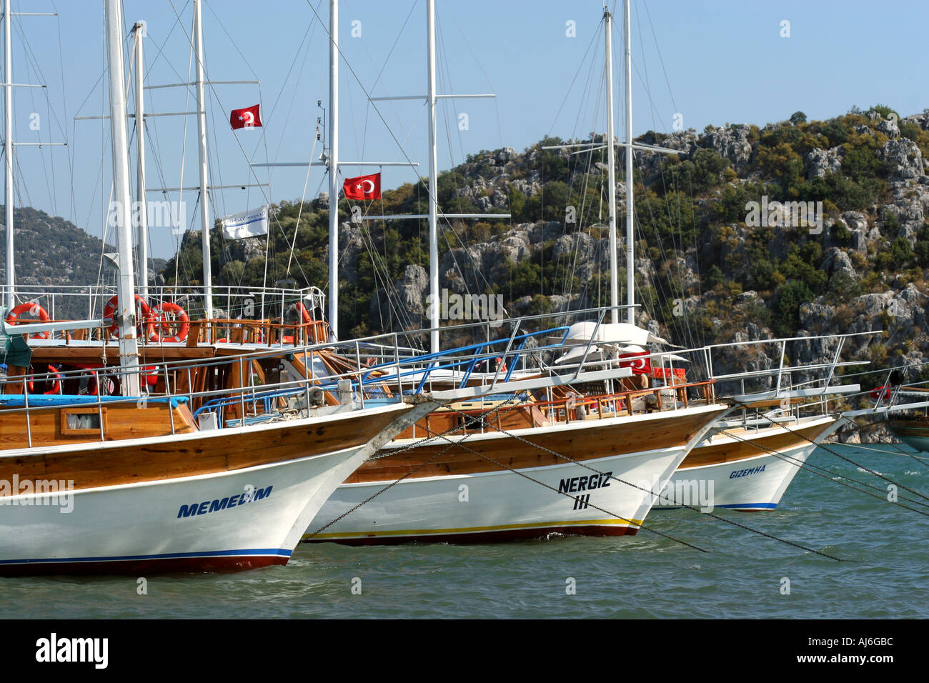 Yachts and gulets moored in Ucagiz harbour Anatolia southern Turkey  Stock Photo