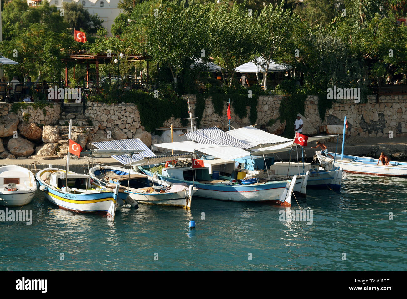 Fishing boats moored in Kalkan harbour Turkey  Stock Photo