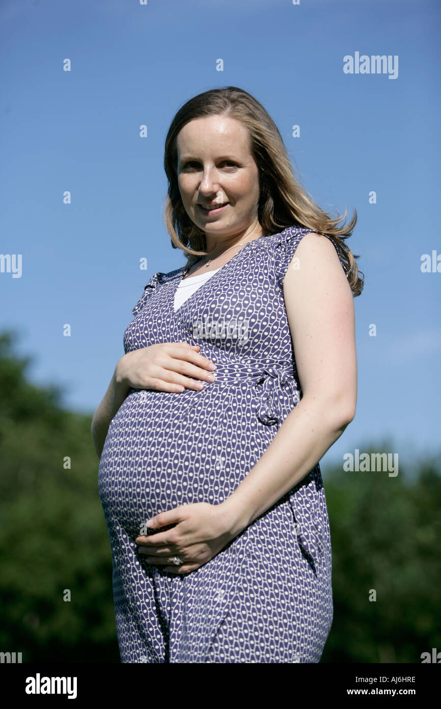 Woman pregnant in a park happy Stock Photo