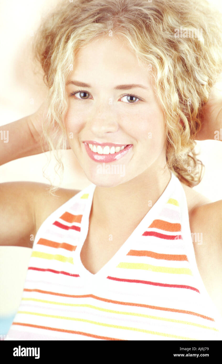 Young woman with a blonde curly hair Stock Photo - Alamy