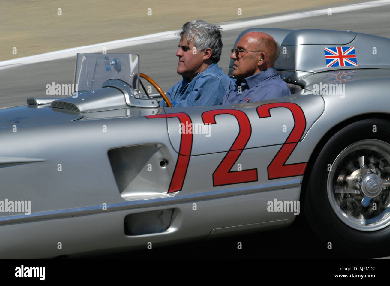 Stirling Moss takes Jay Leno for a ride in the 1955 Mille Miglia winning 722 Mercedes Benz 300SLR at the Monterey Historics 2005 Stock Photo