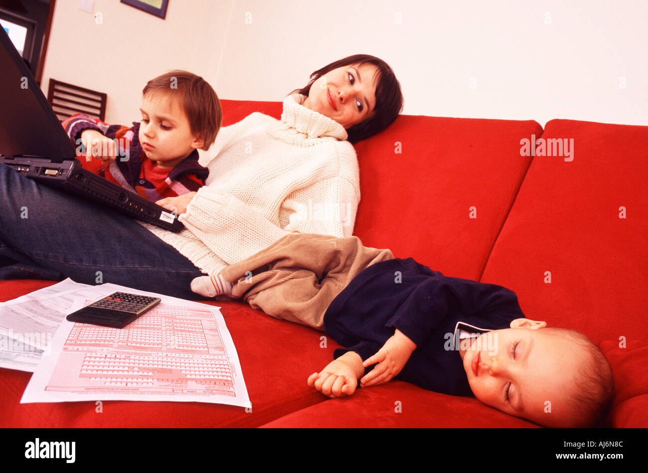 woman-with-two-children-at-home-stock-photo-alamy