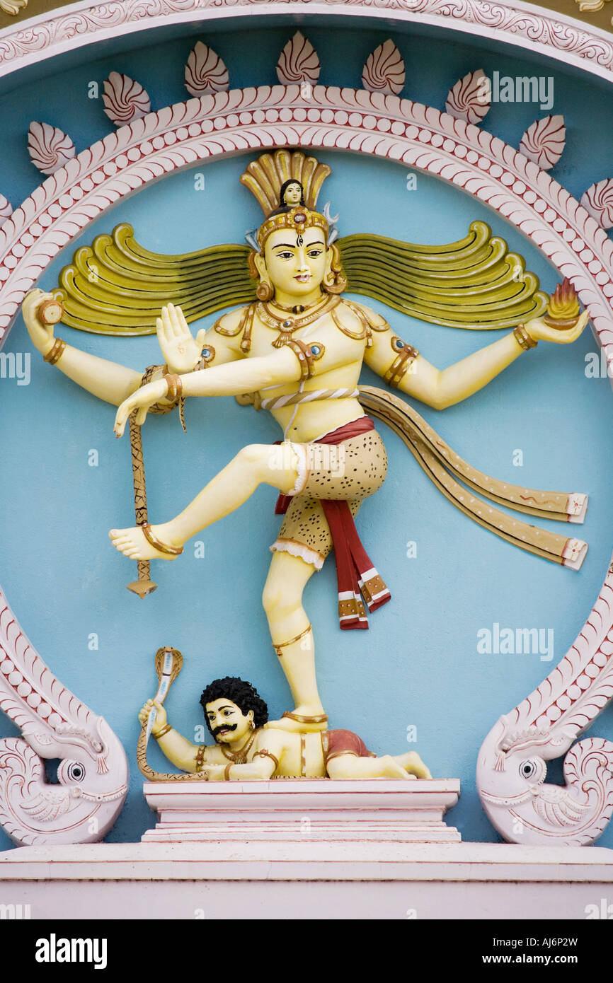 Dancing shiva nataraja statue on the exterior of a university building  in the town of Puttaparthi, Andhra Pradesh, India Stock Photo