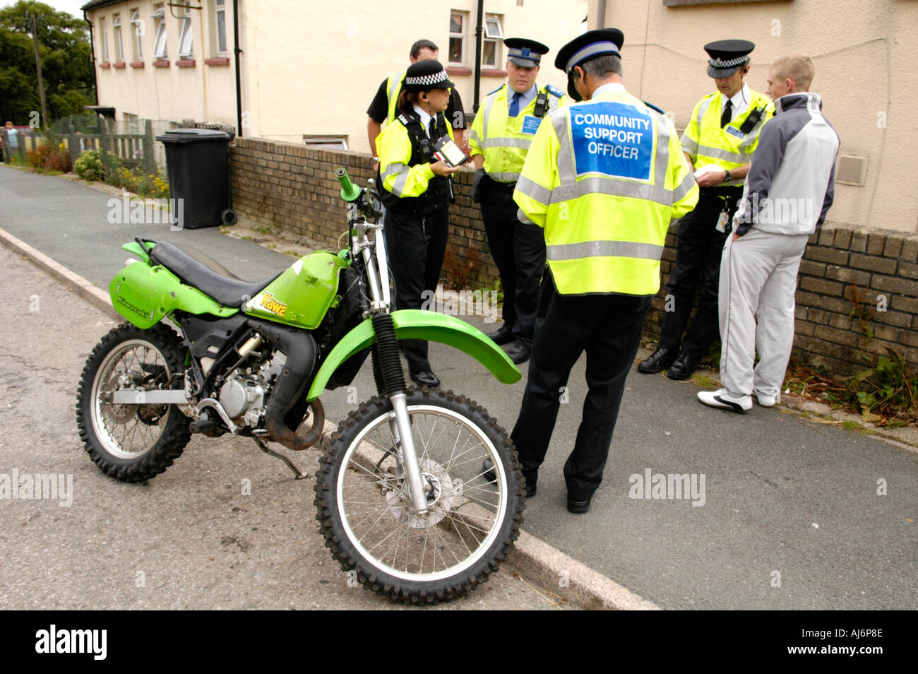 Police and Community Support Officers seize a scrambler motorbike being ...