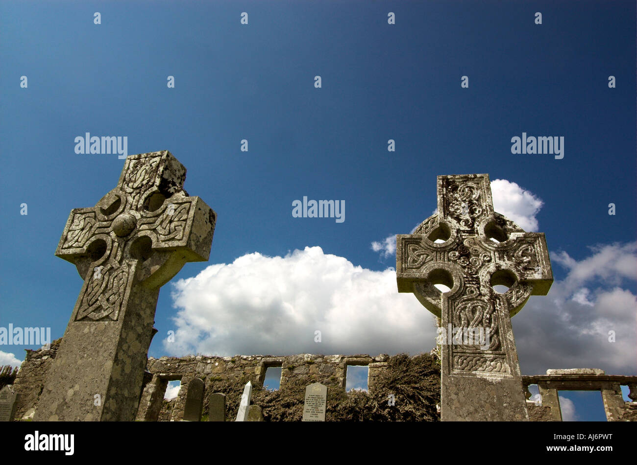 Two ornate celtic cross gravestones against the blue sky in the ruins of Cill Chriosd church near Broadford on the Isle of Skye Stock Photo
