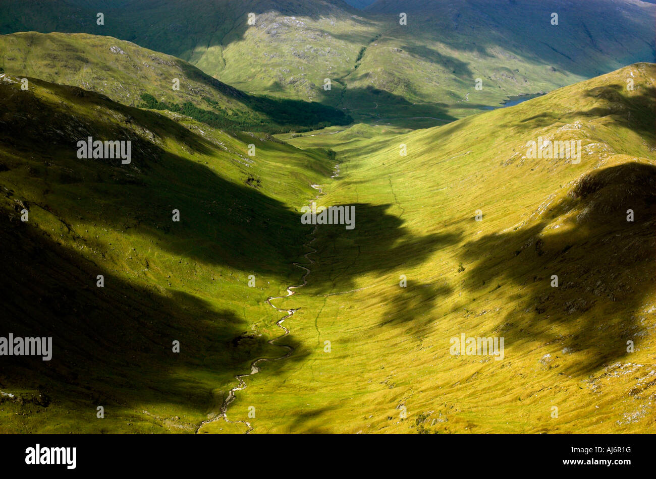 cloud shadows in the valleys as seen from the summit of a Scottish ...