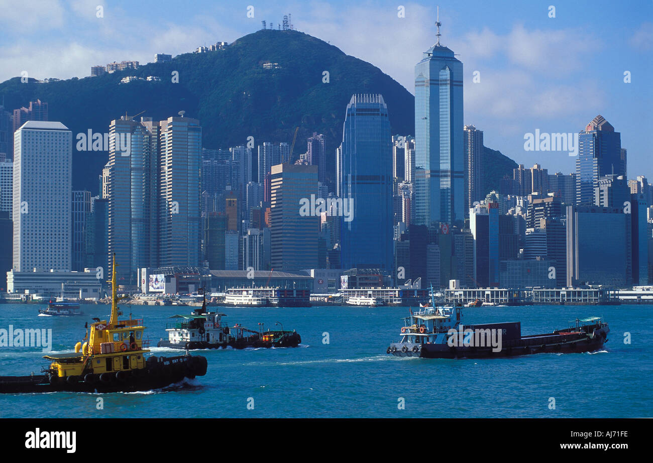 The skyline from Kowloon with busy harbour traffic Kowloon Hong Kong China Stock Photo