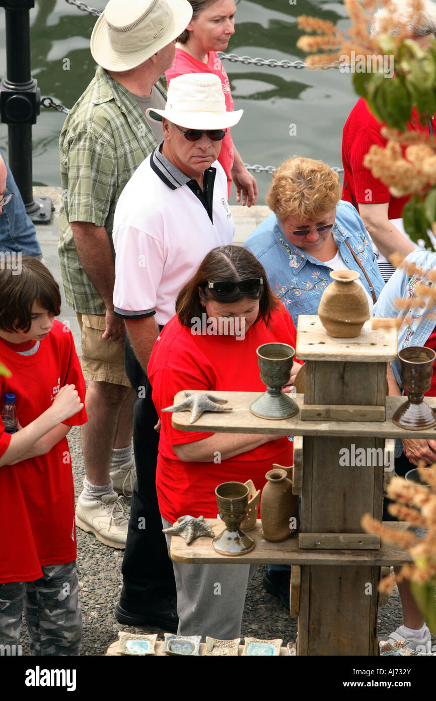People in downtown Victoria during Canada Day celebration looking at ...