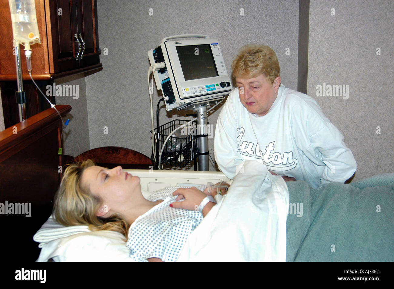 Female Recovers in Hospital After Birth of Child Stock Photo