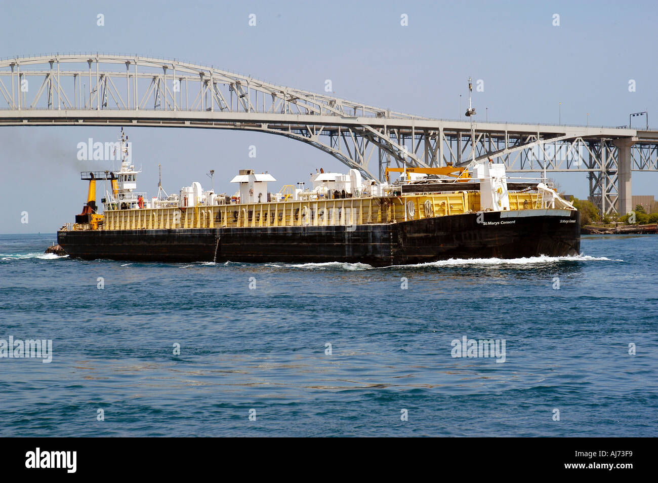 Tug Boat Pushes Barge Down St Clair River at Port Huron Michigan Stock