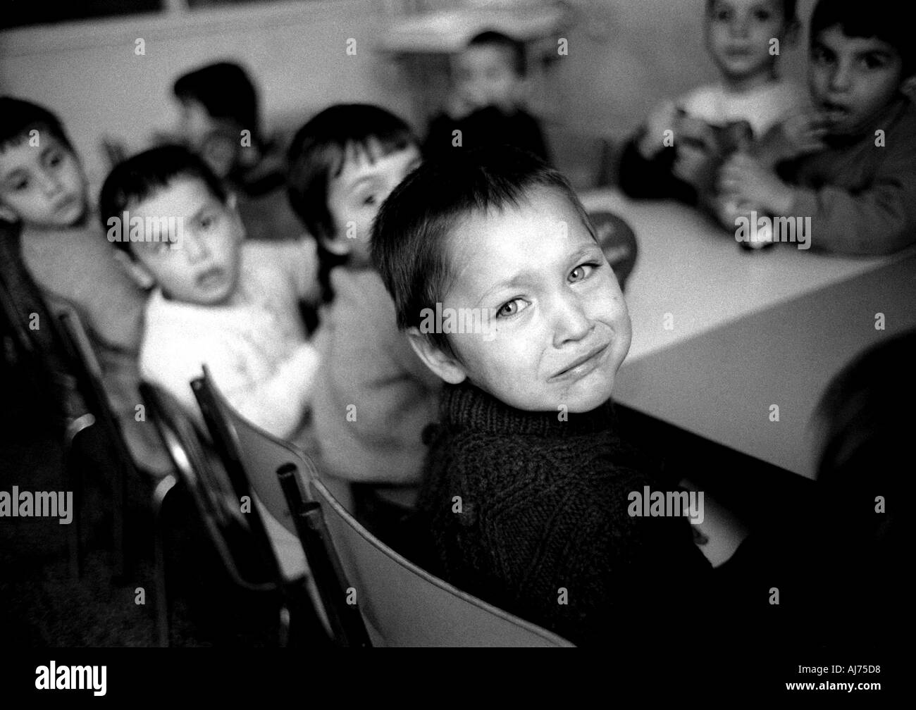 Romania young boy crying at the Cernavodă orphanage in eastern Romania after the fall of Nicolae Ceaușescu Stock Photo