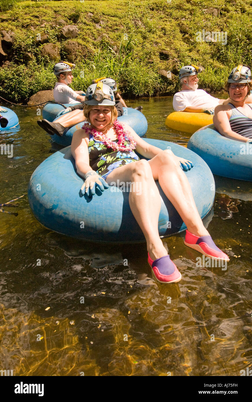 Hawaii Kauai Tourists Tourist enjoying a backcountry mountain tubing