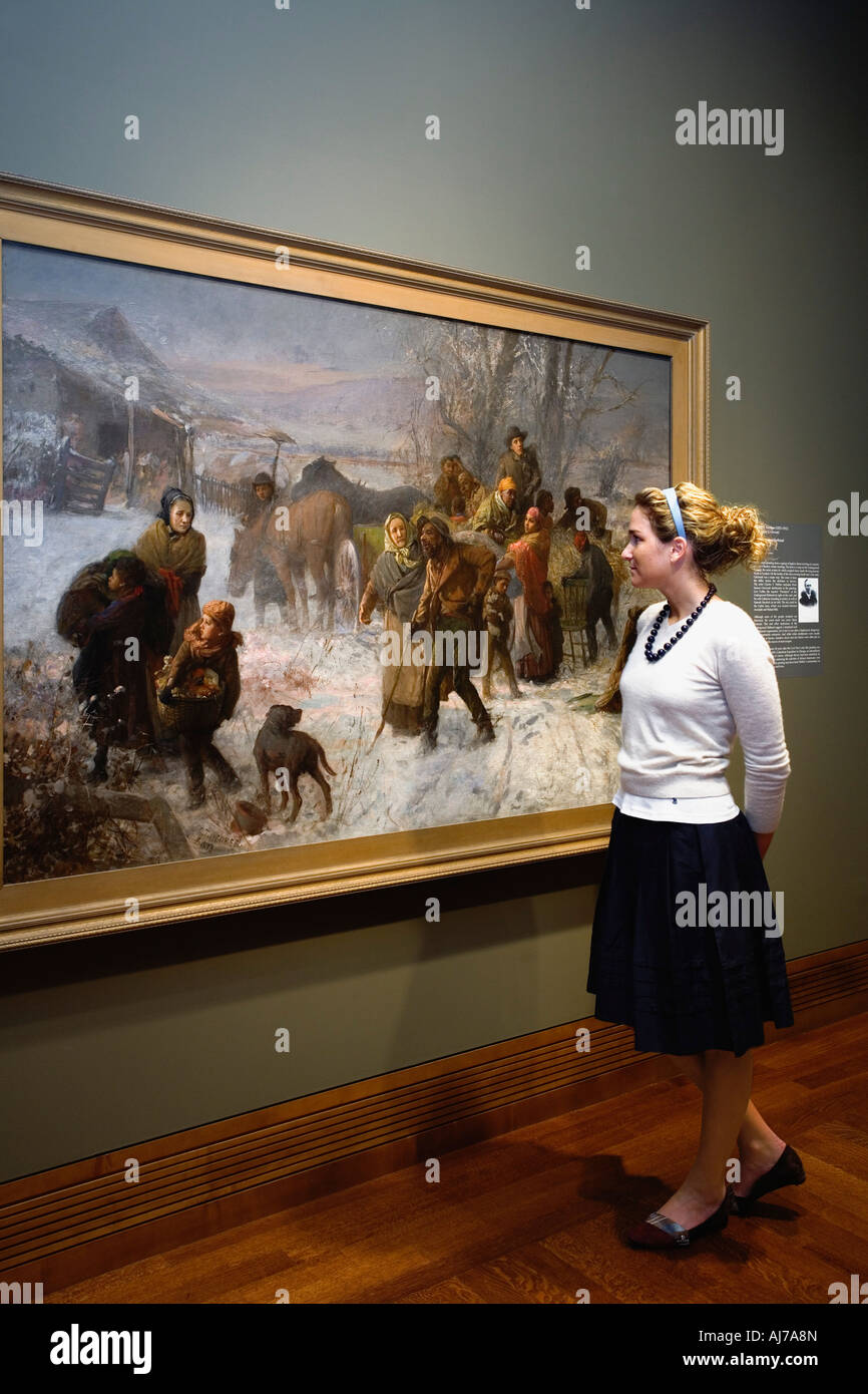 Visitor of the Cincinnati Art Museum viewing The Underground Railroad by Charles T Webber, Cincinnati Ohio. Stock Photo