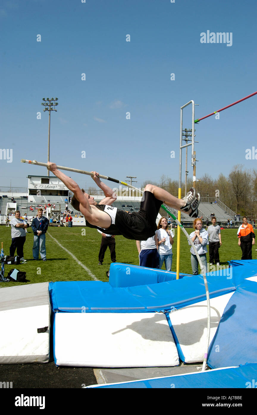 Males Participate in Tack and Field Meet Event Pole Vaulting Stock