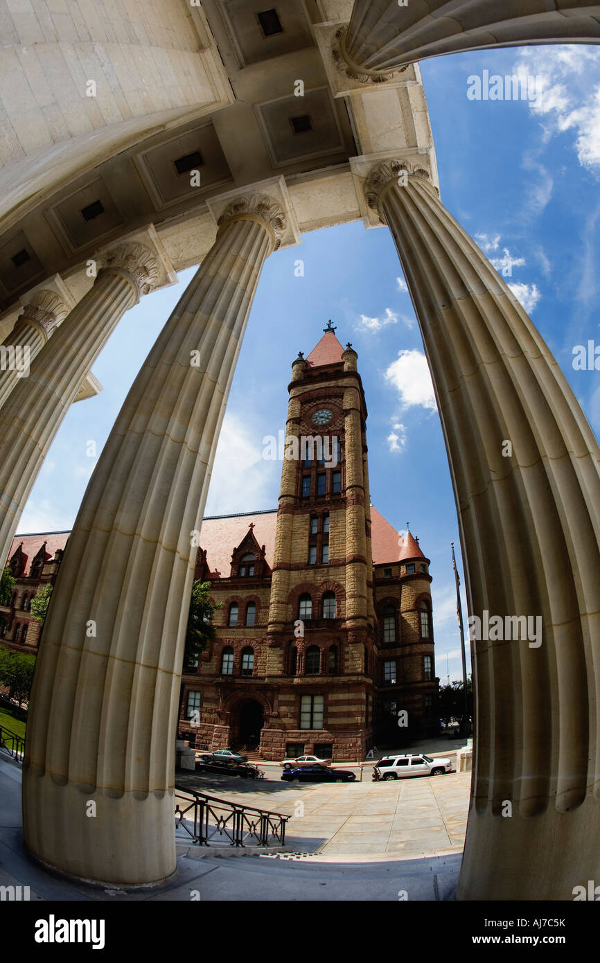 Creative view of the Romanesque style Cincinnati City Hall seen through the huge columns of St Peter and Chains cathedral, Ohio Stock Photo