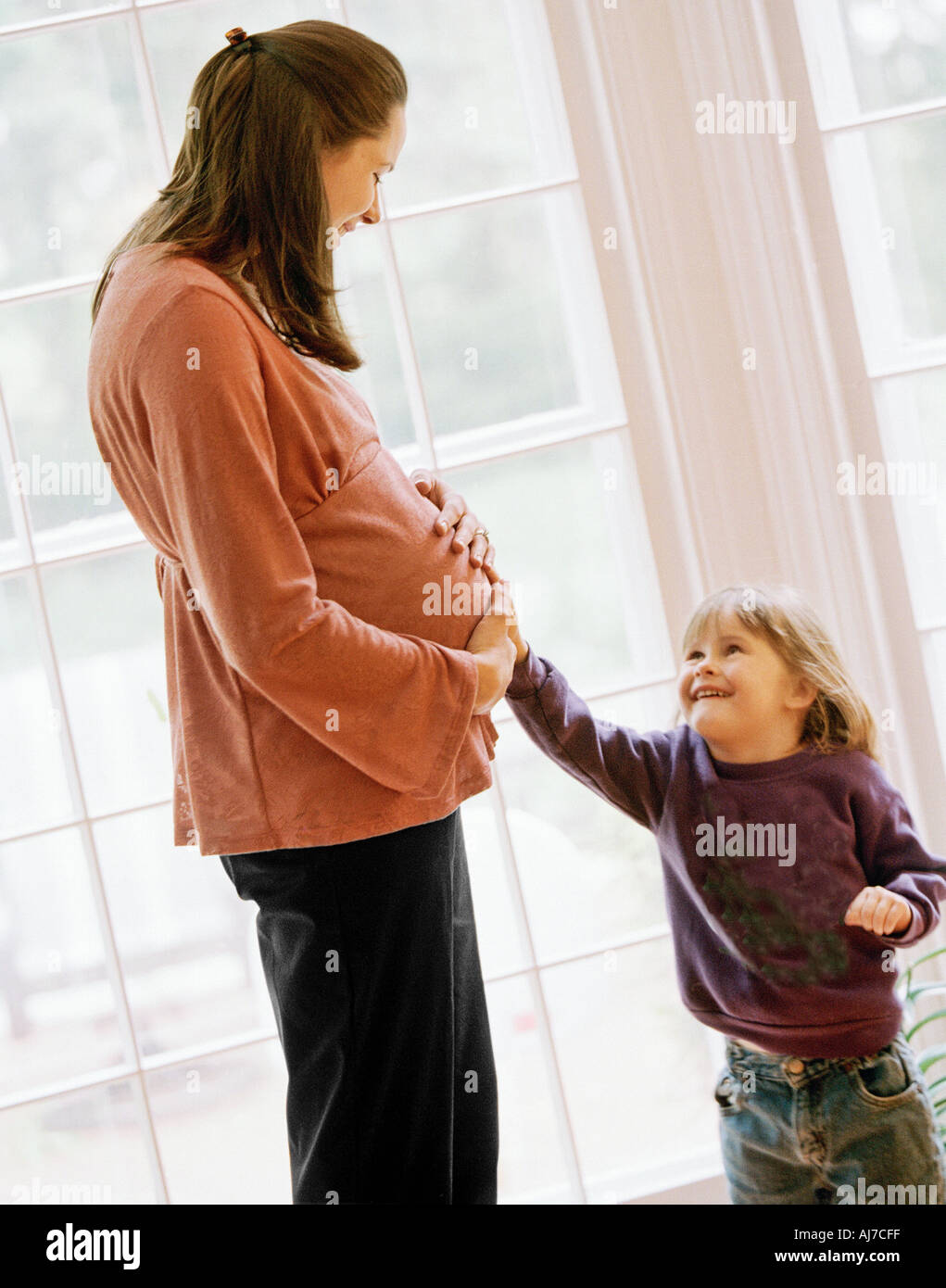 Pregnant woman with child Stock Photo - Alamy