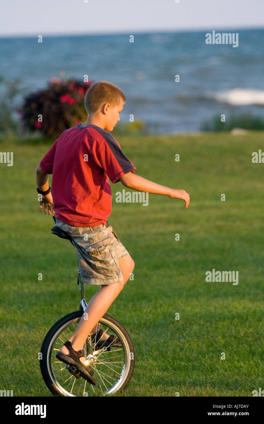 Boy unicycle hires stock photography and images Alamy