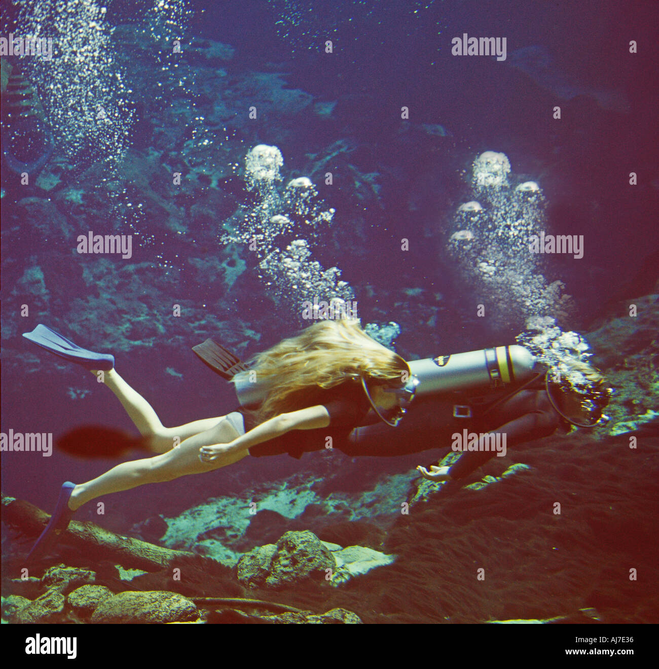 two skin divers cave diving in Florida spring Stock Photo