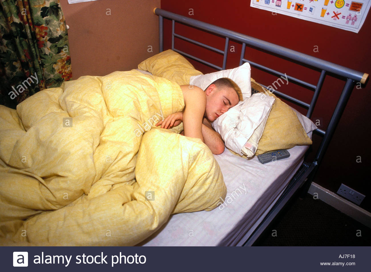 15 Year Old Boy Asleep In His Bed In Bedroom Uk Stock Photo