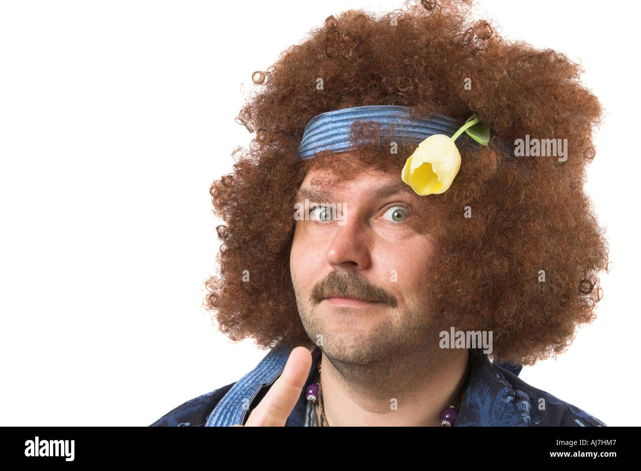 Mature man with tulip in his hair Stock Photo